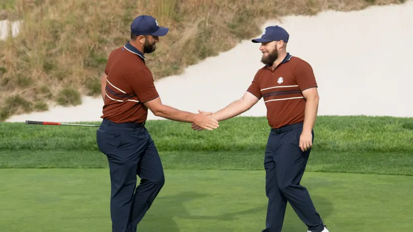 Jon Rahm and Tyrrell Hatton of Team Europe high five during the morning foursomes of the Ryder Cup at Bethpage Black Golf Course on Saturday, September 27, 2025 in Farmingdale, New York. (Photo by Charles Laberge/LIV Golf)