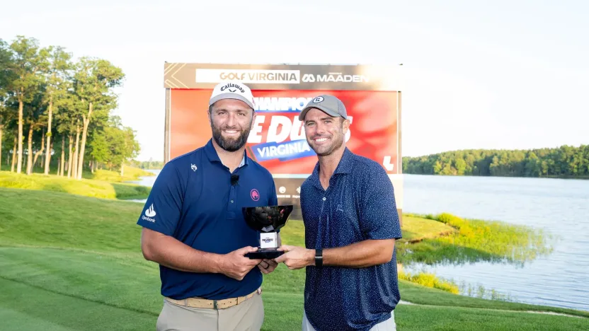 Captain Jon Rahm of Legion XIII and content creator, Wesley Bryan pose for a photo with the Duels Virginia trophy  on the 18th green before the start of LIV Golf Virginia at Robert Trent Jones Golf Club on Tuesday, June 03, 2025 in Gainesville, Virginia. (Photo by Charles Laberge/LIV Golf)