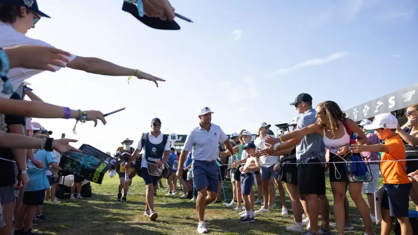 Captain Bryson DeChambeau of Crushers GC high fives fans after the second round of LIV Golf Chicago at Bolingbrook Golf Club on Saturday, September 14, 2024 in Bolingbrook, Illinois. (Photo by LIV Golf)