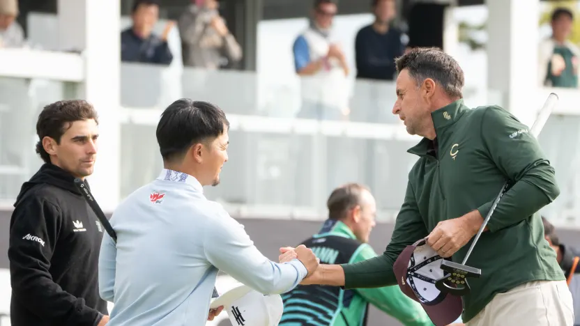 Jinichiro Kozuma of Iron Heads GC shakes hands with Richard Bland of Cleeks GC on the 18th green after the second round of LIV Golf Korea at Jack Nicklaus Golf Club on Saturday, May 03, 2025 in Incheon, South Korea. (Photo by Mike Stobe/LIV Golf)