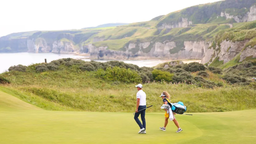 Co-Captain Henrik Stenson of Majesticks GC and his caddie, Fanny Sunneson, walk on the fifth green during the final round of The Open Championship at Royal Portrush Golf Club on Sunday, July 20, 2025 in Portrush, Northern Ireland. (Photo by Chris Trotman/LIV Golf)