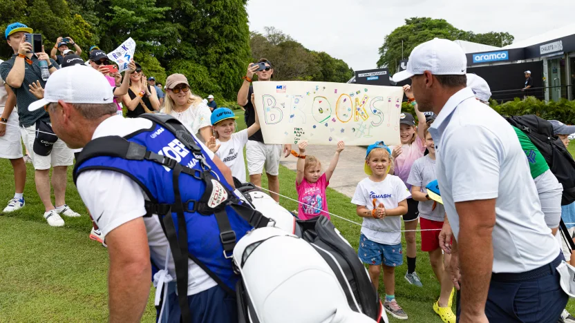 Young golf fans hold up signs for Captain Brooks Koepka of Smash GC during the final round of LIV Golf Singapore at Sentosa Golf Club on Sunday, March 16, 2025 in Sentosa, Singapore. (Photo by Jon Ferrey/LIV Golf)