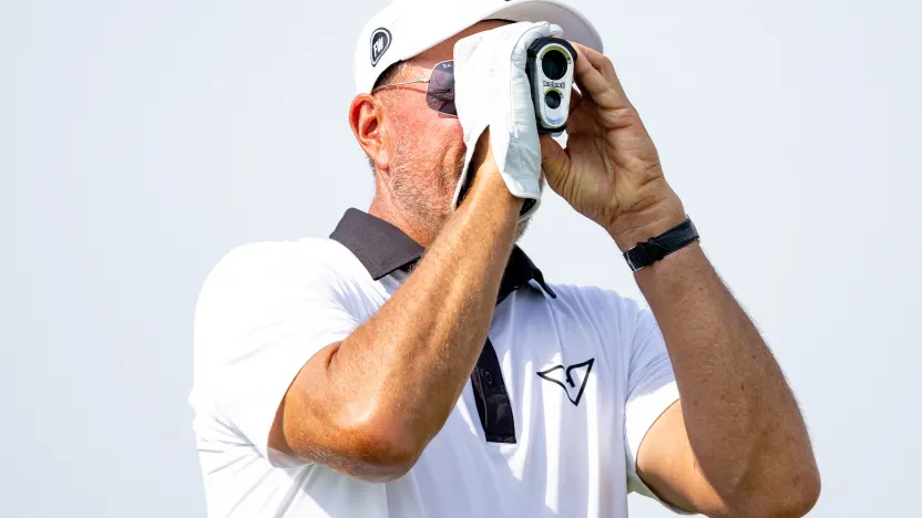 Captain Phil Mickelson of HyFlyers GC looks through his range finder on the fourth tee during the final round of LIV Golf Chicago at Bolingbrook Golf Club on Sunday, August 10, 2025 in Bolingbrook, Illinois. (Photo by Jon Ferrey/LIV Golf)
