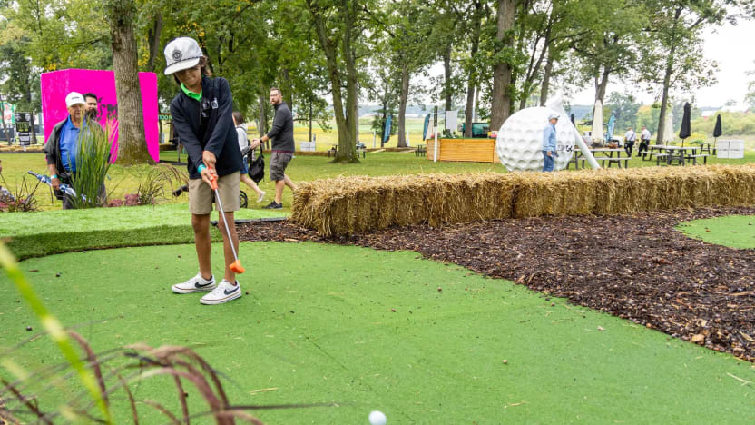 A young golf fan putts in the Kids Zone at the fan village before the first round of LIV Golf Chicago at the Rich Harvest Farms on Friday, September 22, 2023 in Sugar Grove, Illinois. (Photo by Doug DeFelice/LIV Golf)