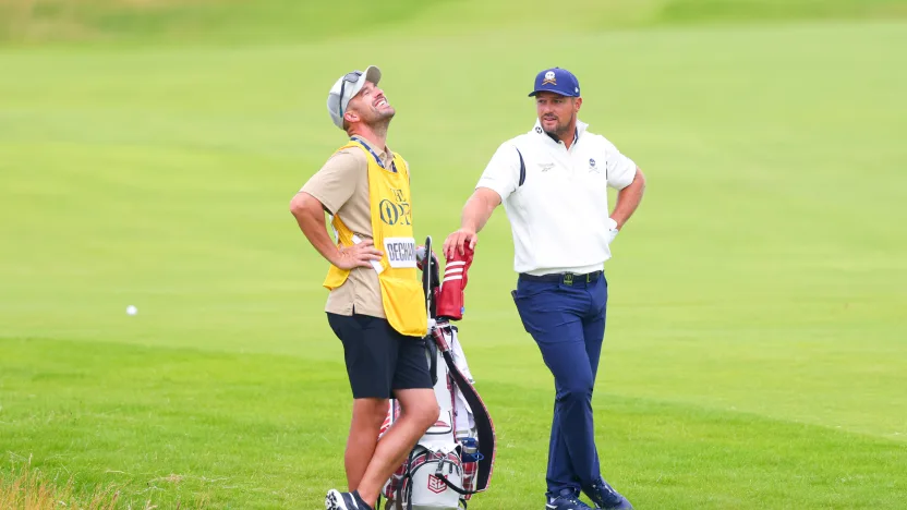 Captain Bryson DeChambeau of Crushers GC and his caddie, Greg Bodine, wait on the second hole during the third round of The Open Championship at Royal Portrush Golf Club on Saturday, July 19, 2025 in Portrush, Northern Ireland. (Photo by Chris Trotman/LIV Golf)