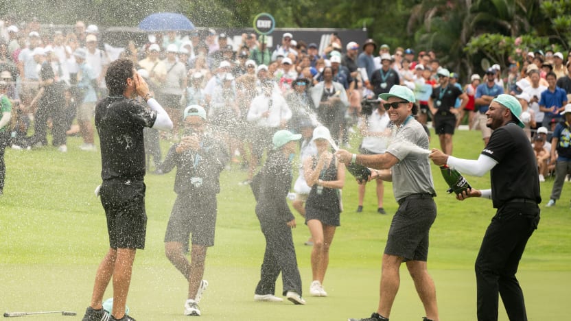 First place individual champion, Captain Joaquín Niemann of Torque GC sprayed with champagne by Sebastián Muñoz of Torque GC after the final round of LIV Golf Singapore at Sentosa Golf Club on Sunday, March 16, 2025 in Sentosa, Singapore. (Photo by Charles Laberge/LIV Golf)