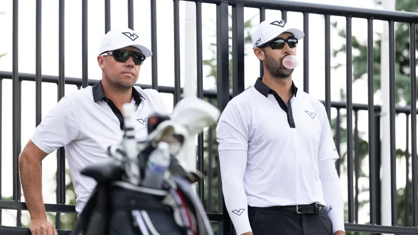 Cameron Tringale of HyFlyers GC and caddie, Jonathan Smart are seen on the first tee during the practice round before the start of LIV Golf Indianapolis at The Club at Chatham Hills on Wednesday, August 13, 2025 in Westfield, Indiana. (Photo by Scott Taetsch/LIV Golf)