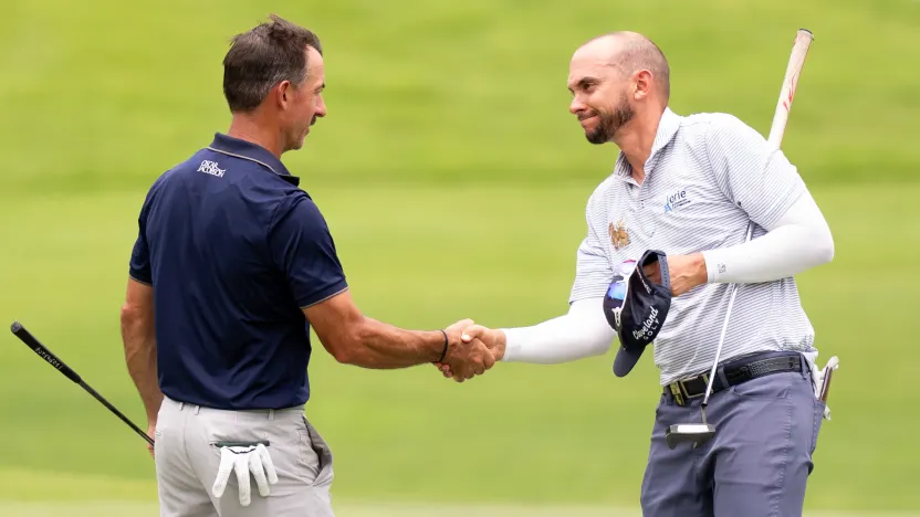 Alternate, Wade Ormsby shakes hands with Alternate, John Catlin, on the 18th hole during the practice round before the start of LIV Golf Singapore at Sentosa Golf Club on Tuesday, March 11, 2025 in Sentosa, Singapore. (Photo by Pedro Salado/LIV Golf)