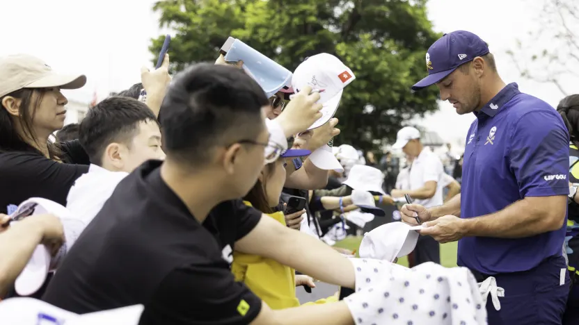 Captain Bryson DeChambeau of Crushers GC signs his autograph after the second round of LIV Golf Hong Kong at Hong Kong Golf Club Fanling on Saturday, March 08, 2025 in Fanling, Hong Kong. (Photo by Chris Trotman/LIV Golf)