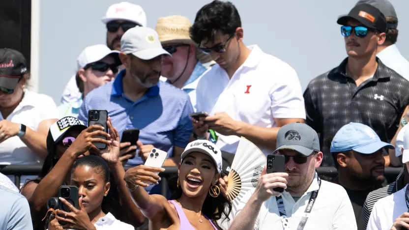 Show Host, Sarah Fontenot takes a photo on the first tee during the second round of LIV Golf Chicago at Bolingbrook Golf Club on Saturday, August 09, 2025 in Bolingbrook, Illinois. (Photo by Charles Laberge/LIV Golf)