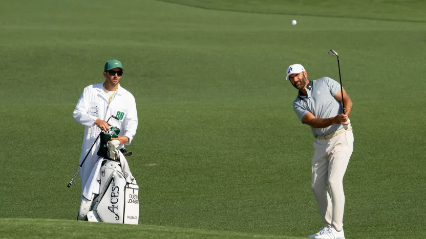 4Aces GC caddie, Austin Johnson, watches as Captain Dustin Johnson of 4Aces GC hits his shot during the practice round before the start of The Masters at the Augusta National Golf Club on Wednesday, April 09, 2025 in Augusta, Georgia. (Photo by Montana Pritchard/LIV Golf)