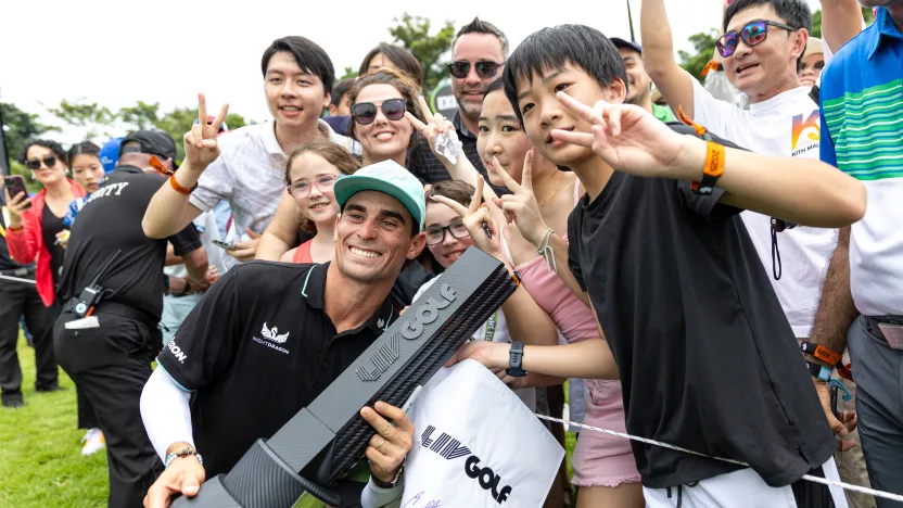 First place individual champion, Captain Joaquín Niemann of Torque GC celebrates with the Individual Champion Trophy and fans after the final round of LIV Golf Singapore at Sentosa Golf Club on Sunday, March 16, 2025 in Sentosa, Singapore. (Photo by Jon Ferrey/LIV Golf)