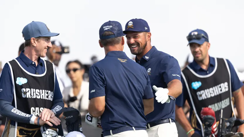 Captain Bryson DeChambeau and Paul Casey of Crushers GC are seeing talking on the first tee during the final round of LIV Golf Chicago at Bolingbrook Golf Club on Sunday, August 10, 2025 in Bolingbrook, Illinois. (Photo by Katelyn Mulcahy/LIV Golf)