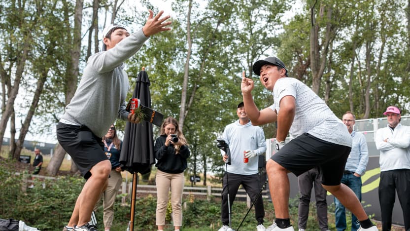 Danny Lee of Iron Heads GC and his caddie, Ki Taek Lee, gesture on the first tee during the Caddie Tournament before the start of LIV Golf United Kingdom at JCB Golf & Country Club on Wednesday, July 23, 2025 in Rocester, England. (Photo by Mateo Villalba/LIV Golf)