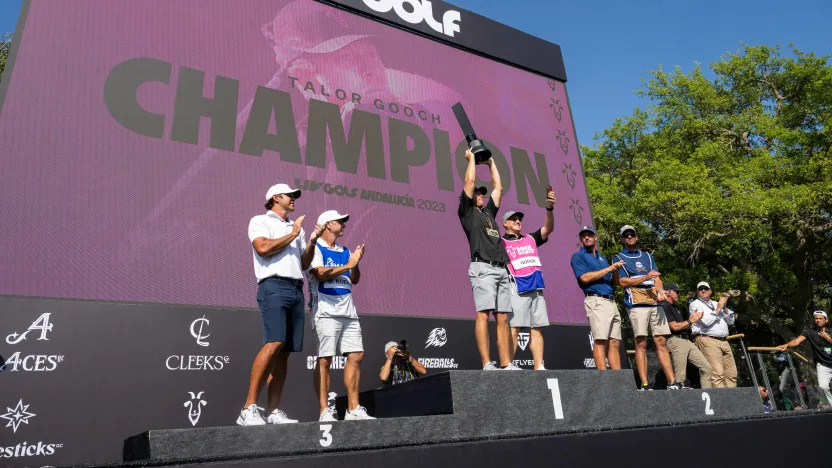 First place individual champion Talor Gooch of RangeGoats GC celebrates along with Second place individual champion Captain Bryson DeChambeau of Crushers GC and Third place individual champion Captain Brooks Koepka of Smash GC during the trophy ceremony of LIV Golf Andalucía at the Real Club Valderrama on Sunday, July 02, 2023 in San Roque, Spain. (Photo by Montana Pritchard/LIV Golf)