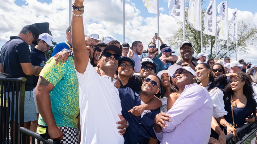 AJ Calloway takes a selfie of former NBA players, John Salley, Isiah Thomas, actor Larenz Tate, influencer Nikki Blades and podcaster Sarah Fontenot on the first tee before the final round of LIV Golf Team Championship Michigan at The Cardinal at Saint John’s on Sunday, August 24, 2025 in Plymouth, MIchigan. (Photo by Pedro Salado/LIV Golf)