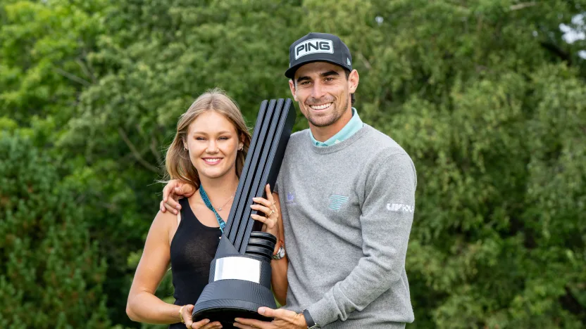 First place individual champion, Captain Joaquín Niemann of Torque GC and his wife, Christina Hellema (Titi), pose with the trophy after the final round of LIV Golf United Kingdom at JCB Golf & Country Club on Sunday, July 27, 2025 in Rocester, England. (Photo by Montana Pritchard/LIV Golf)