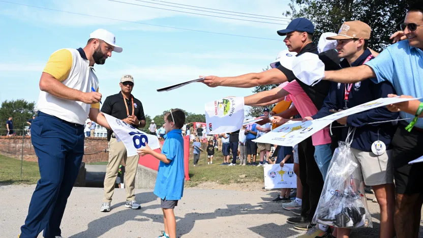 Jon Rahm of Team Europe is signs autographs for fans during the practice round before the start of Ryder Cup at Bethpage Black Golf Course on Tuesday, September 23, 2025 in Farmingdale, New York. (Photo by Charles Laberge/LIV Golf)