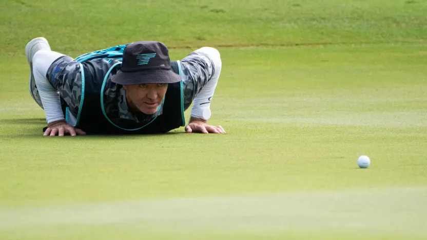 Torque GC caddie, Michael Kerr, reads his putt on the 17th hole during the second round of LIV Golf Hong Kong at Hong Kong Golf Club Fanling on Saturday, March 08, 2025 in Fanling, Hong Kong. (Photo by Mike Stobe/LIV Golf)