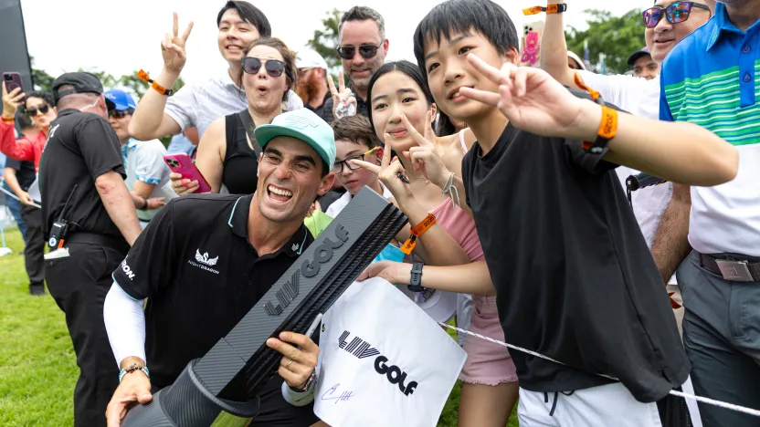 First place individual champion, Captain Joaquín Niemann of Torque GC celebrates with the Individual Champion Trophy and fans after the final round of LIV Golf Singapore at Sentosa Golf Club on Sunday, March 16, 2025 in Sentosa, Singapore. (Photo by Jon Ferrey/LIV Golf)