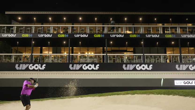 image: Captain Bubba Watson of RangeGoats GC hits his shot from a bunker on the 18th hole during the practice round before the start of LIV Golf Riyadh at Riyadh Golf Club on Tuesday, Feb. 04, 2025 in Riyadh, Saudi Arabia. (Photo by Chris Trotman/LIV Golf)