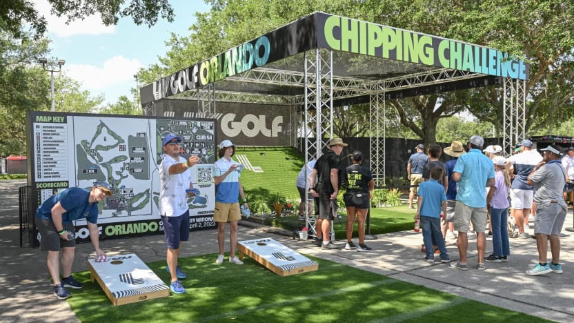 Fans play cornhole near the chipping challenge in the Fan Village before the second round of LIV Golf Orlando at Orange County National on Saturday, Apr. 01, 2023 in Winter Garden, Florida. (Photo by Montana Pritchard/LIV Golf)
