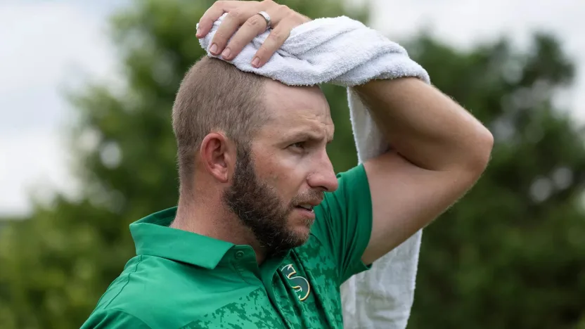 Dean Burmester of Stinger GC uses a towel on the sixth tee during the final round of LIV Golf Nashville at The Grove on Sunday, June 23, 2024 in College Grove, Tennessee. (Photo by Sam Greenwood/LIV Golf)