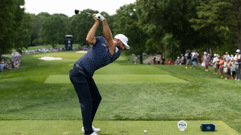 Captain Dustin Johnson of 4Aces GC hits his shot from the sixth tee during the first round of the 2025 PGA Championship at Quail Hollow Club on Thursday, May 15, 2025 in Charlotte, North Carolina. (Photo by Jon Ferrey/LIV Golf)