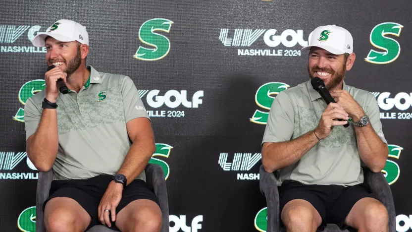 image: Dean Burmester of Stinger GC and Captain Louis Oosthuizen of Stinger GC speak at a press conference during the pro-am before the start of LIV Golf Nashville at The Grove on Thursday, June 20, 2024 in College Grove, Tennessee. (Photo by Jon Ferrey/LIV Golf)