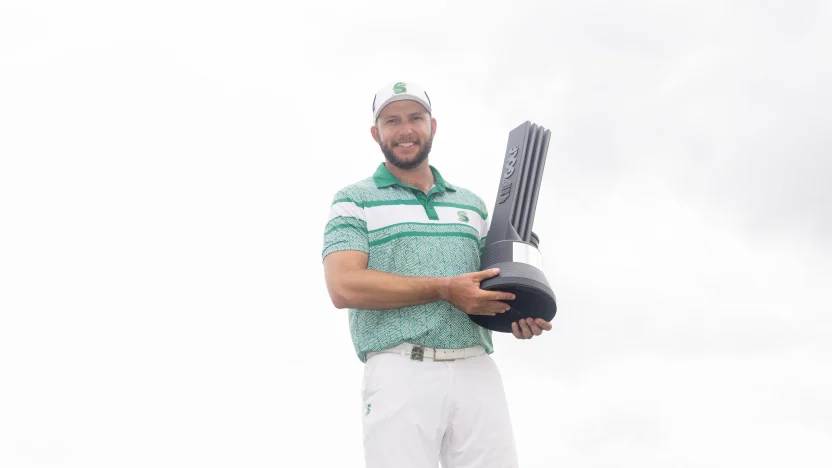 First place individual champion, Dean Burmester of Stinger GC poses for a photo with the trophy following the final round of LIV Golf Chicago at Bolingbrook Golf Club on Sunday, August 10, 2025 in Bolingbrook, Illinois. (Photo by Chris Trotman/LIV Golf)