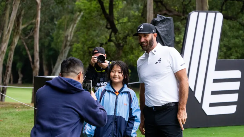 Captain Dustin Johnson of 4Aces GC poses for a photo with a fan during the practice round before the start of LIV Golf Hong Kong at Hong Kong Golf Club Fanling on Wednesday, March 05, 2025 in Fanling, Hong Kong. (Photo by Mike Stobe/LIV Golf)