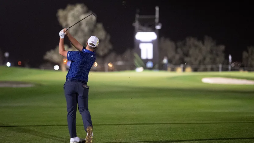 image: Caleb Surratt of Legion XIII hits his shot from the fairway on the 11th hole during the first round of LIV Golf Riyadh at Riyadh Golf Club on Thursday, February 06, 2025 in Riyadh, Saudi Arabia. (Photo by Pedro Salado/LIV Golf)