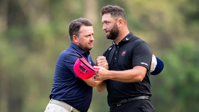 Graeme McDowell of Smash GC shakes hands with Captain Jon Rahm of Legion XIII on the first green during the final round of LIV Golf Hong Kong at Hong Kong Golf Club Fanling on Sunday, March 09, 2025 in Fanling, Hong Kong. (Photo by Mateo Villalba/LIV Golf)