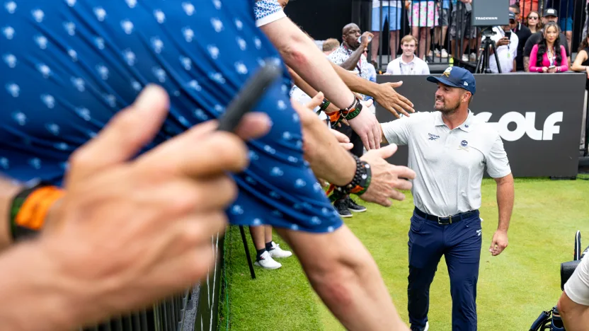 Captain Bryson DeChambeau of Crushers GC high-fives fans on the first tee during the second round of LIV Golf Virginia at Robert Trent Jones Golf Club on Saturday, June 07, 2025 in Gainesville, Virginia. (Photo by Charles Laberge/LIV Golf)