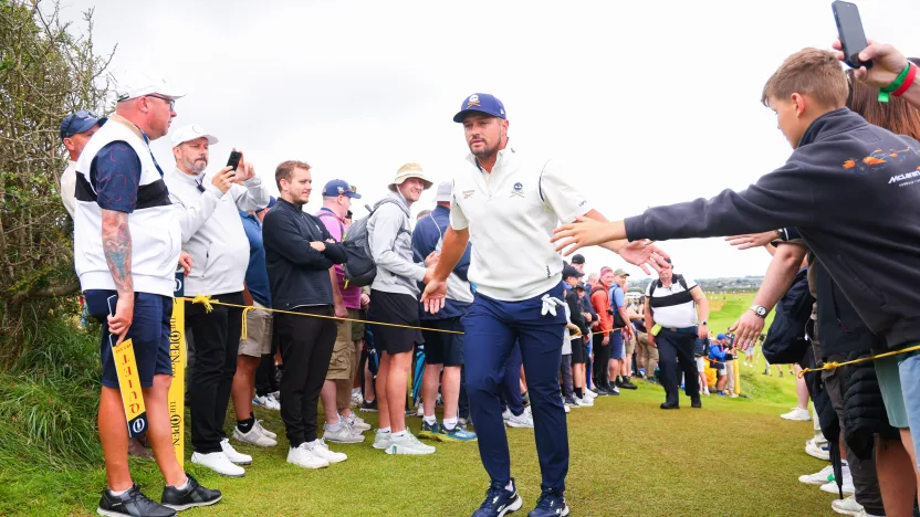 Captain Bryson DeChambeau of Crushers GC greets fans as he walks off the third hole during the third round of The Open Championship at Royal Portrush Golf Club on Saturday, July 19, 2025 in Portrush, Northern Ireland. (Photo by Chris Trotman/LIV Golf)