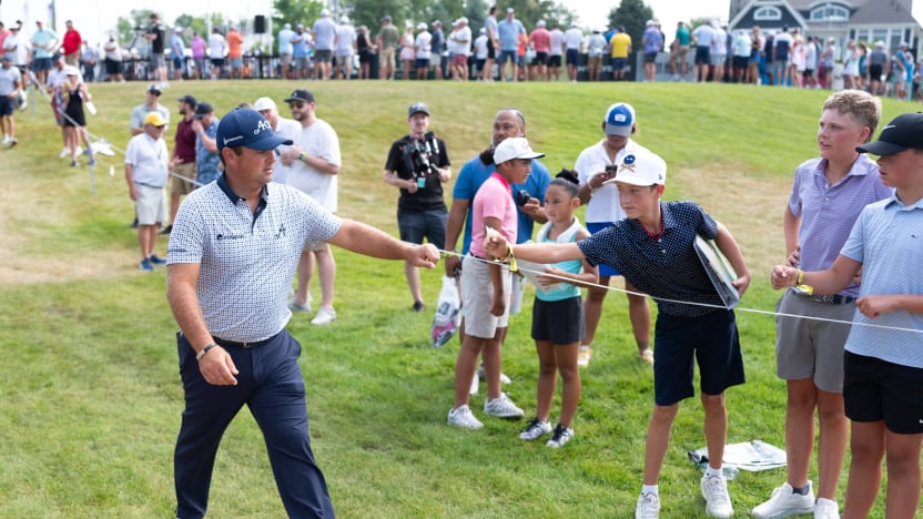 Patrick Reed of 4Aces GC fist bumps young fans before the first round of LIV Golf Indianapolis at The Club at Chatham Hills on Friday, August 15, 2025 in Westfield, Indiana. (Photo by Mateo Villalba/LIV Golf)