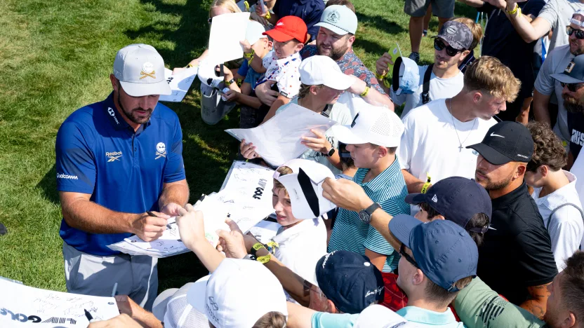 Captain Bryson DeChambeau of Crushers GC signs autographs for fans before the first round of LIV Golf Chicago at Bolingbrook Golf Club on Friday, August 08, 2025 in Bolingbrook, Illinois. (Photo by Charles Laberge/LIV Golf)