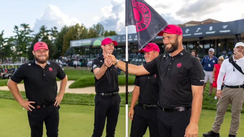 Team Champions Captain Jon Rahm, Tyrrell Hatton, Caleb Surratt and Tom McKibbin of Legion XIII stand near their pin flag on the 18th green following the final round of LIV Golf Team Championship Michigan at The Cardinal at Saint John’s on Sunday, August 24, 2025 in Plymouth, MIchigan. (Photo by Scott Taetsch/LIV Golf)