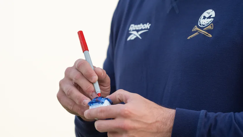 image: A detailed view of Captain Bryson DeChambeau of Crushers GC marking his ball on the practice green before the final round of LIV Golf Riyadh at Riyadh Golf Club on Saturday, February 08, 2025 in Riyadh, Saudi Arabia. (Photo by Mateo Villalba/LIV Golf)