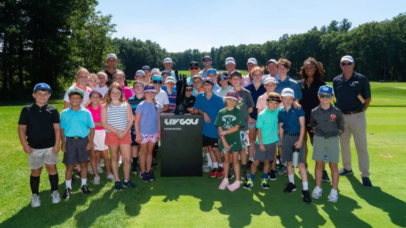 BOLTON, MASSACHUSETTS - AUGUST 30: Richard Bland, Turk Pettit, Cameron Tringale, Troy Mullins and participants pose for a photo during the Bolton Youth Baseball & Softball Youth Clinic for the LIV Golf Invitational at the International Golf Club on August 30, 2022 in Bolton, Massachusetts. (Photo by Hailey Garrett/LIV Golf)