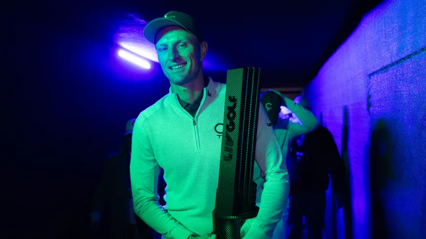 First place individual champion Adrian Meronk of Cleeks GC carries the trophy to the stage for the trophy ceremony after the final round of LIV Golf Riyadh at Riyadh Golf Club on Saturday, February 08, 2025 in Riyadh, Saudi Arabia. (Photo by Chris Trotman/LIV Golf)