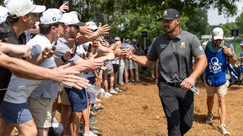 Captain Bryson DeChambeau of Crushers GC greets fans during the first round of the 2025 PGA Championship at Quail Hollow Club on Thursday, May 15, 2025 in Charlotte, North Carolina. (Photo by Jon Ferrey/LIV Golf)