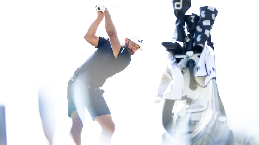 Captain Dustin Johnson of 4Aces GC hits his shot on the driving range before the second round of LIV Golf Chicago at Bolingbrook Golf Club on Saturday, August 09, 2025 in Bolingbrook, Illinois. (Photo by Chris Trotman/LIV Golf)