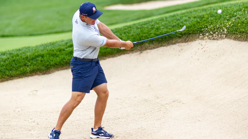 Captain Bryson DeChambeau of Crushers GC hits his shot from a bunker on the third hole during the practice round before the start of LIV Golf Team Championship Michigan at The Cardinal at Saint John’s on Tuesday, August 19, 2025 in Plymouth, MIchigan. (Photo by Jon Ferrey/LIV Golf)