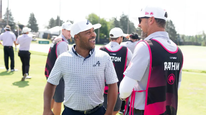 Harold Varner III of 4Aces GC is seen talking to Legion XIII, caddie, Adam Hayes on the driving range before the quarterfinals of LIV Golf Team Championship Michigan at The Cardinal at Saint John’s on Friday, August 22, 2025 in Plymouth, MIchigan. (Photo by Mateo Villalba/LIV Golf)