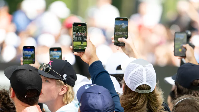 Fans record as Captain Jon Rahm of Legion XIII hits his shot from the second tee during the final round of LIV Golf Team Championship Michigan at The Cardinal at Saint John’s on Sunday, August 24, 2025 in Plymouth, MIchigan. (Photo by Charles Laberge/LIV Golf)