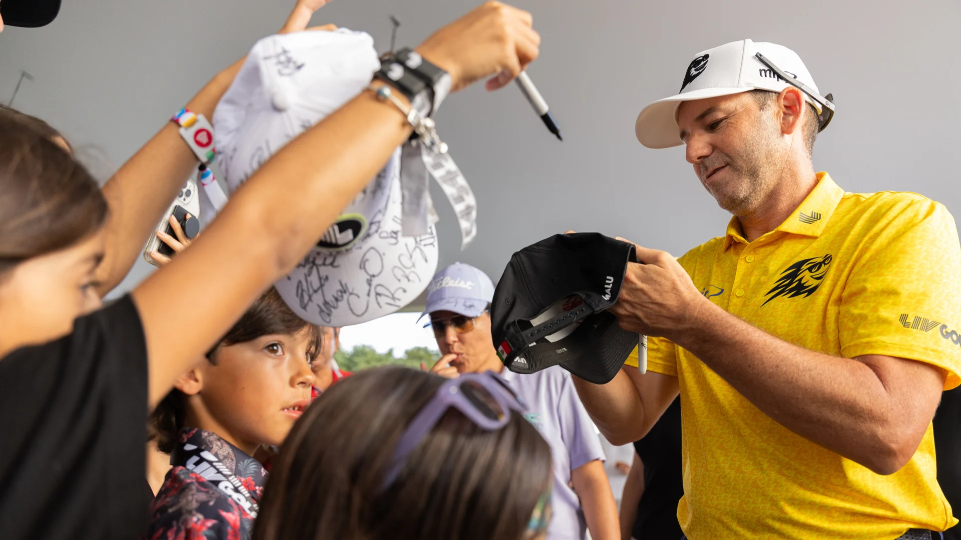 Sergio signs autographs for kids