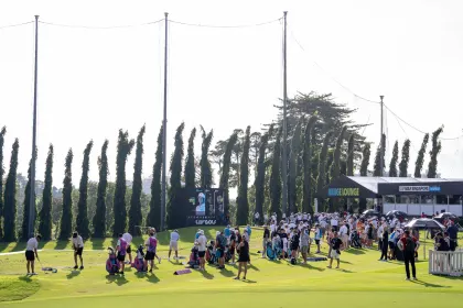 A crowd gathers around the driving range before the first round of LIV Golf Singapore at Sentosa Golf Club on Friday, March 14, 2025 in Sentosa, Singapore. (Photo by Pedro Salado/LIV Golf)